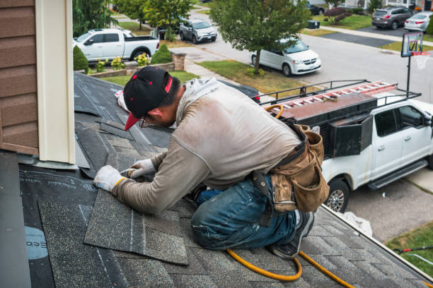 Professional Roofing technician working in Abington, MA